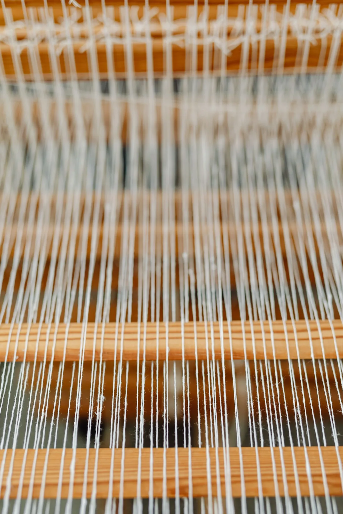 Threads arranged across a weaving loom